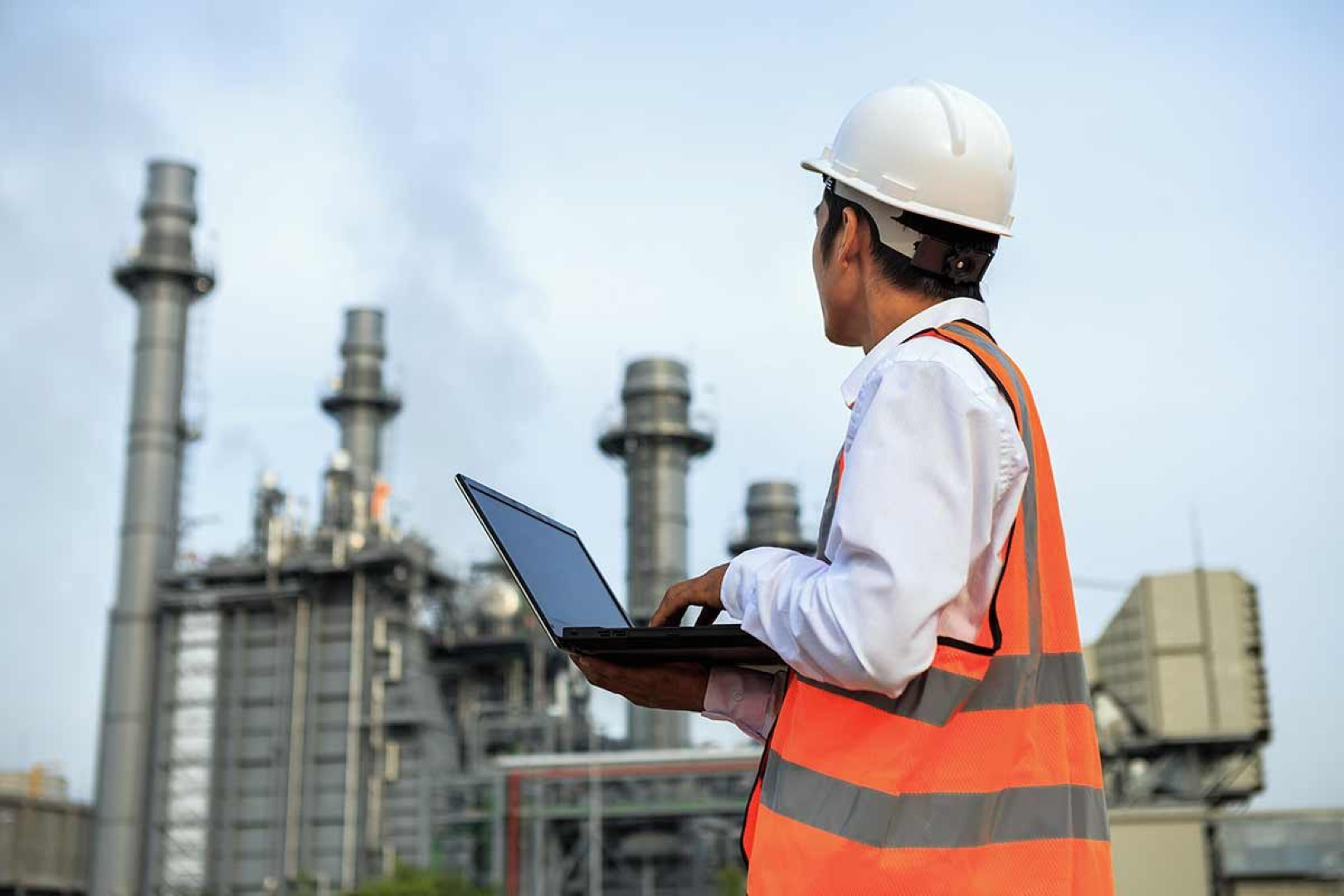 Picture of a construction worker with a laptop