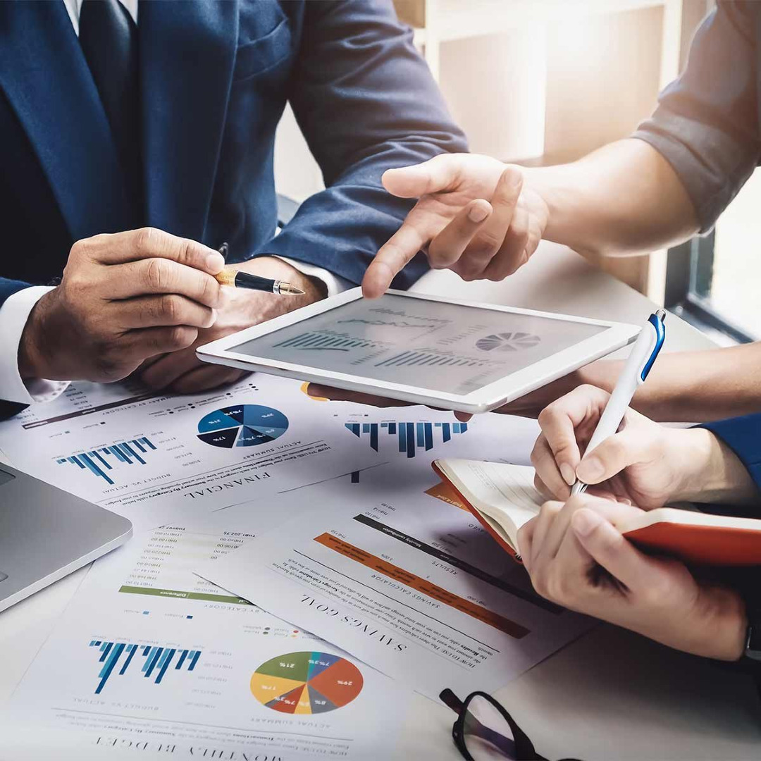 Closeup picture of people's hands together in an office meeting